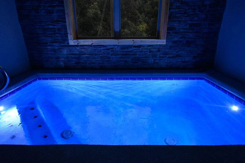 Night photo of your cabin's private pool. at Big Splash Lodge in Gatlinburg TN